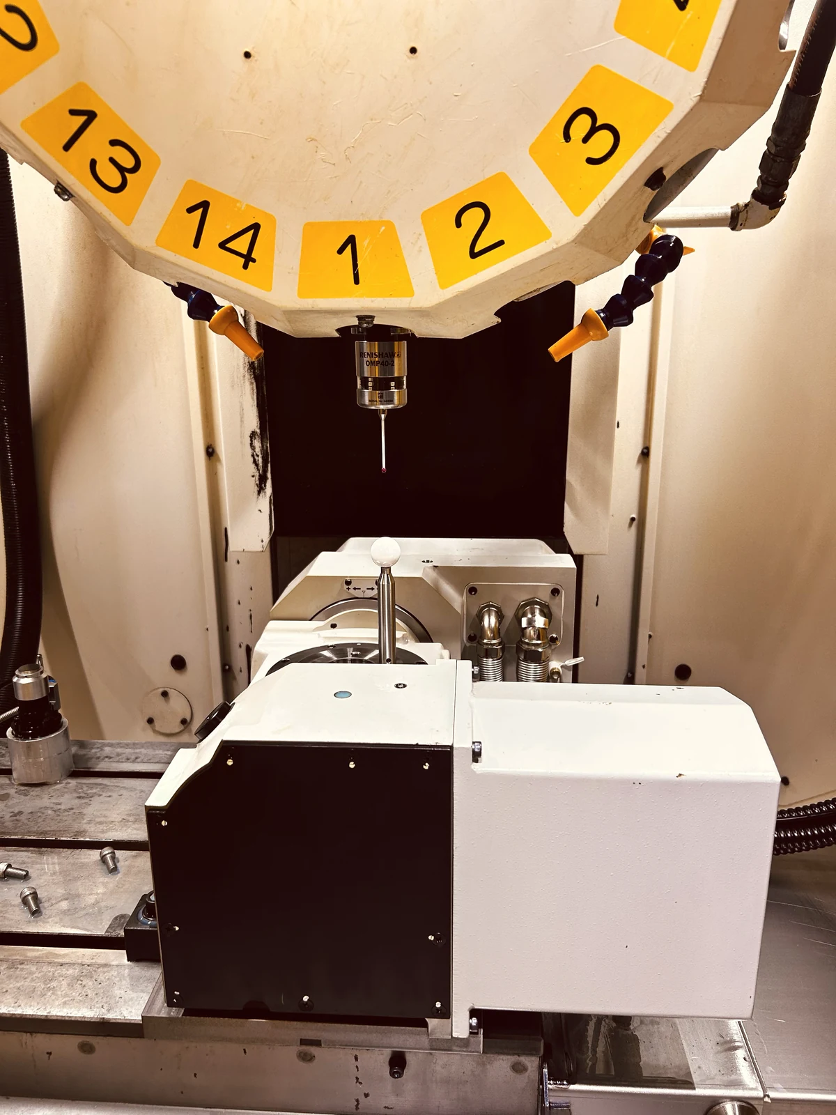 CNC machine with a touch probe and reference sphere